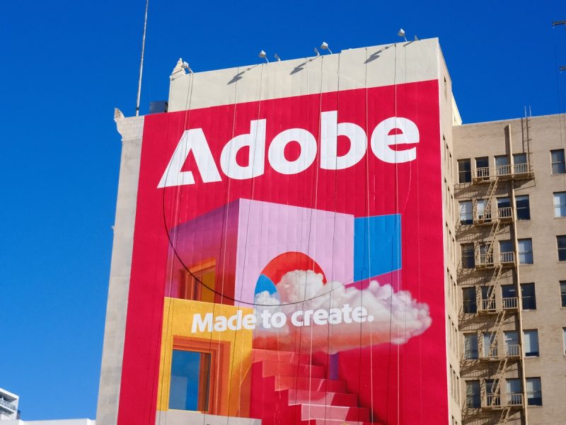 Adobe logo and slogan on a building